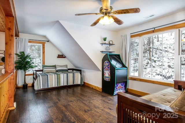 bedroom with dark wood-type flooring, ceiling fan, and vaulted ceiling