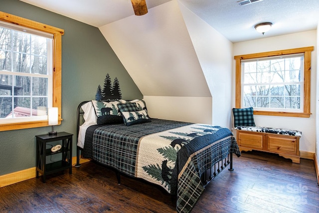 bedroom with dark hardwood / wood-style flooring and vaulted ceiling