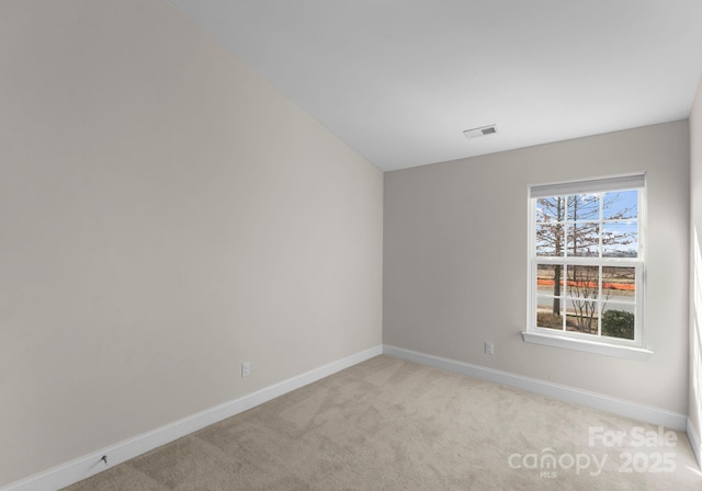 empty room with light colored carpet