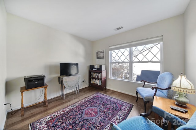 living area featuring hardwood / wood-style floors