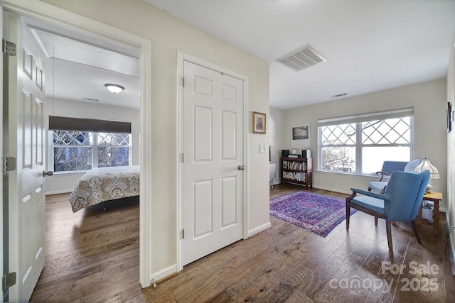 hallway featuring hardwood / wood-style floors and a healthy amount of sunlight