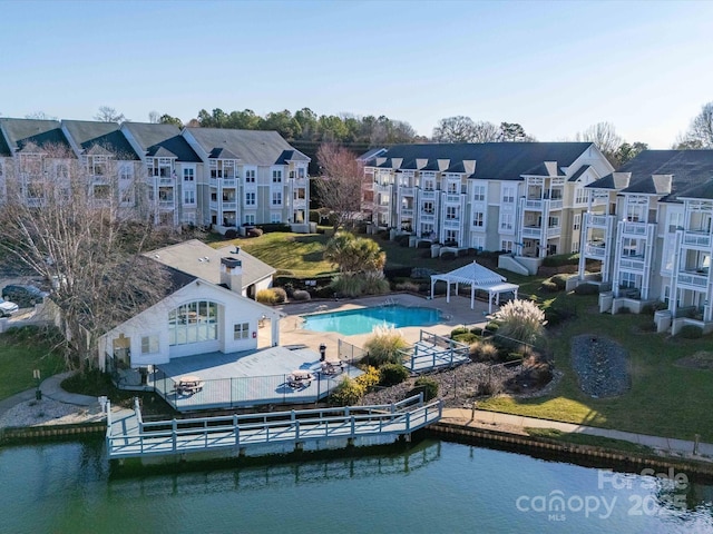 birds eye view of property with a water view