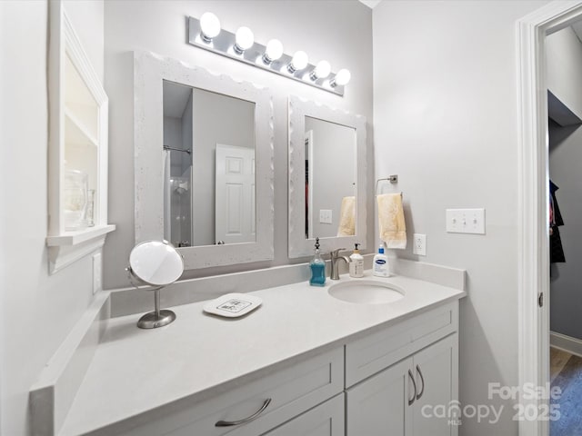 bathroom featuring vanity and a shower with shower curtain