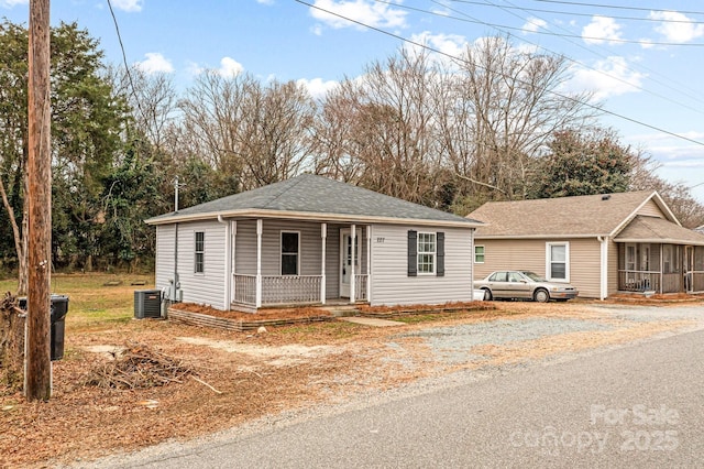 view of front of property featuring cooling unit and covered porch