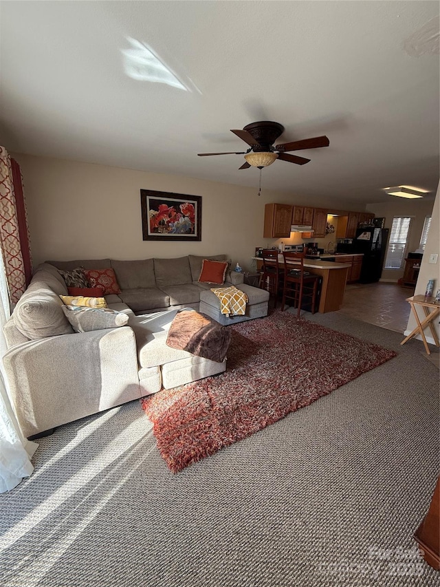 living room with carpet floors and ceiling fan