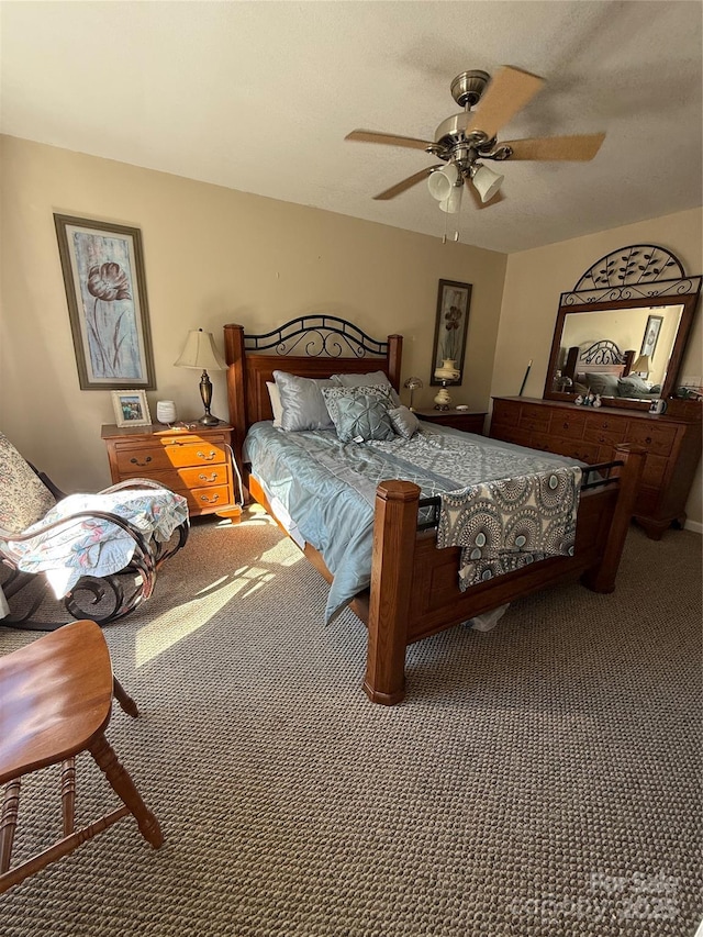 bedroom featuring ceiling fan and carpet floors