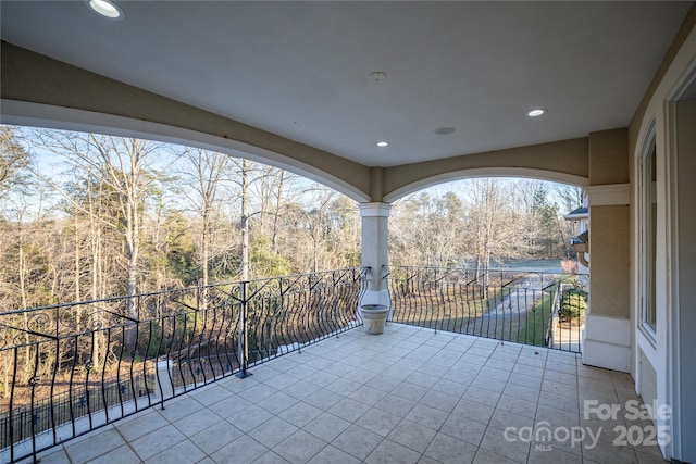 view of patio featuring a balcony