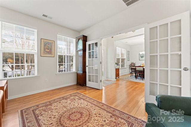 interior space featuring french doors and hardwood / wood-style floors