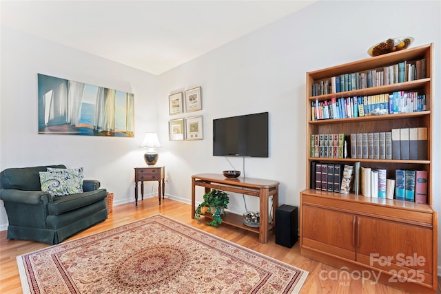 sitting room featuring hardwood / wood-style flooring