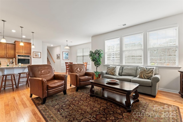 living room featuring light wood-type flooring