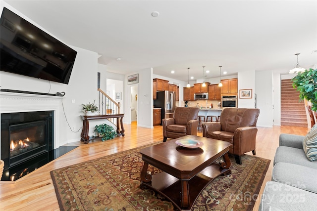 living room with light hardwood / wood-style floors