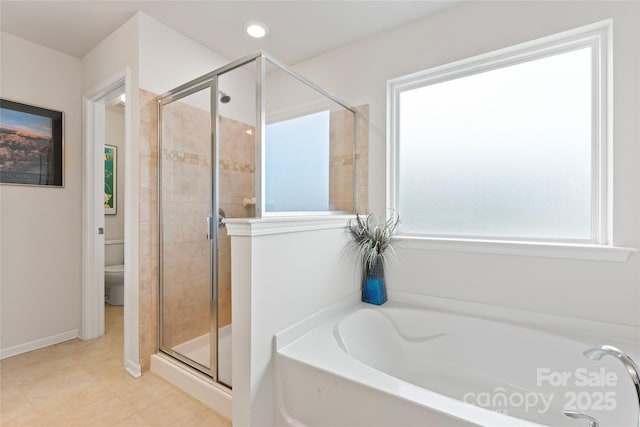 bathroom featuring toilet, shower with separate bathtub, and tile patterned floors