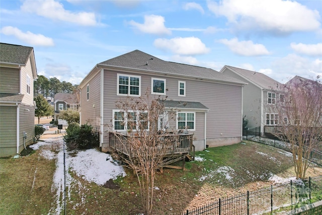 rear view of property with a wooden deck