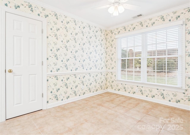 empty room featuring ornamental molding, ceiling fan, and light tile patterned flooring