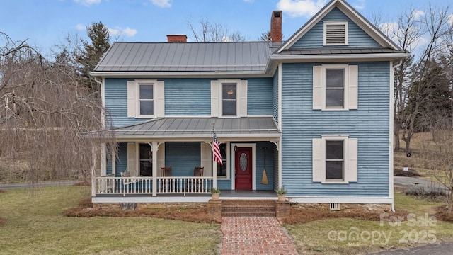 view of front of house with a porch and a front lawn