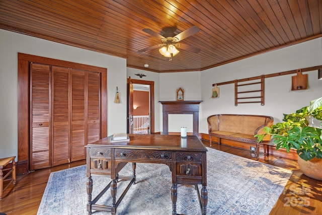 home office with ceiling fan, ornamental molding, wood-type flooring, and wooden ceiling