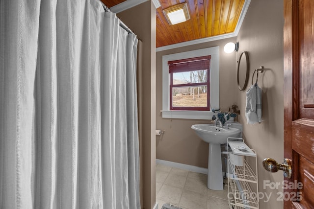 bathroom featuring ornamental molding and wood ceiling