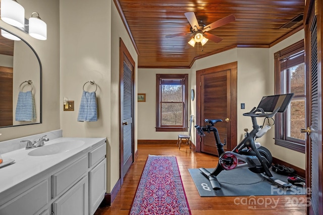 interior space with light wood-type flooring, plenty of natural light, sink, and wooden ceiling