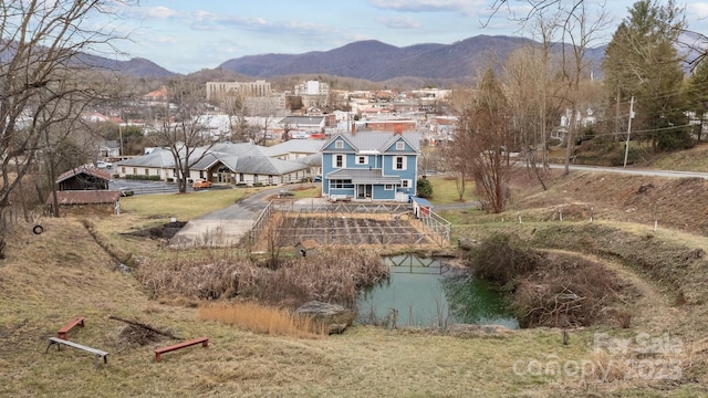 exterior space featuring a water and mountain view