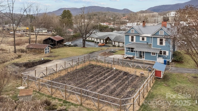 drone / aerial view featuring a mountain view