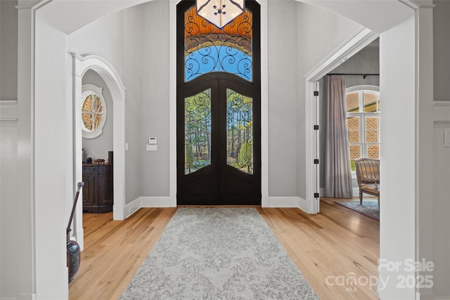 entrance foyer featuring french doors and hardwood / wood-style flooring