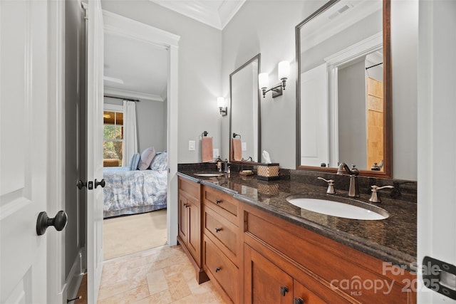 bathroom with vanity and crown molding