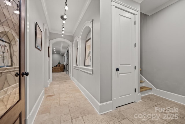 corridor featuring crown molding