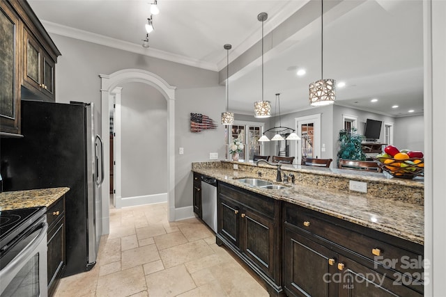 kitchen featuring decorative light fixtures, sink, stainless steel appliances, light stone countertops, and dark brown cabinets