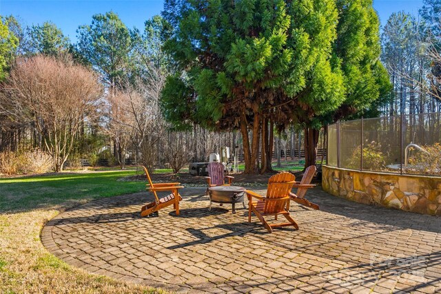 view of patio with an outdoor fire pit