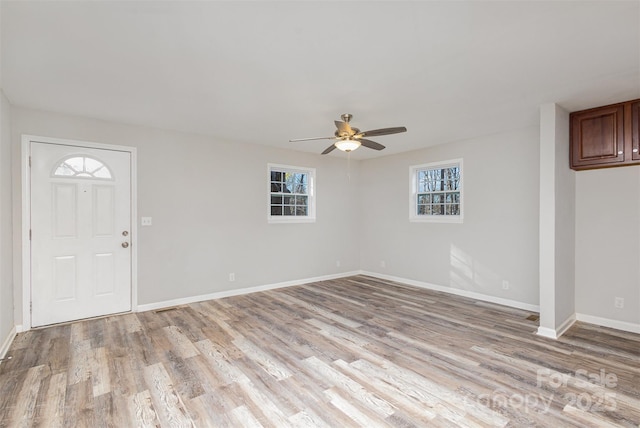 foyer entrance featuring ceiling fan and light hardwood / wood-style floors