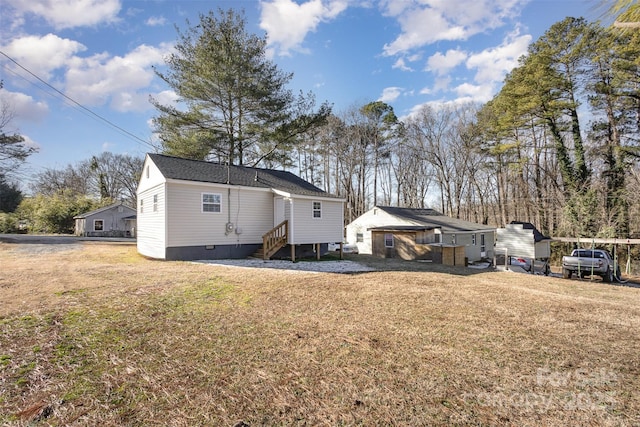 rear view of house with a yard