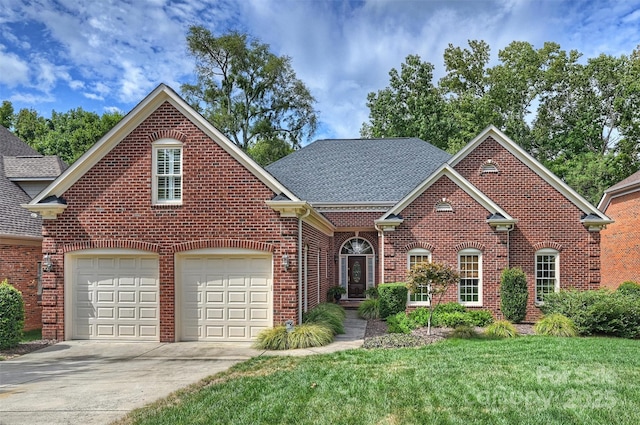 front of property featuring a garage and a front lawn