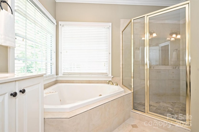 bathroom with tile patterned flooring, vanity, and shower with separate bathtub