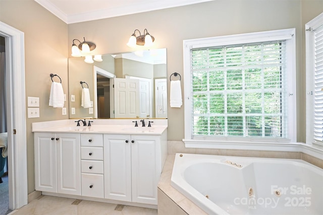 bathroom featuring tiled bath, plenty of natural light, vanity, and ornamental molding