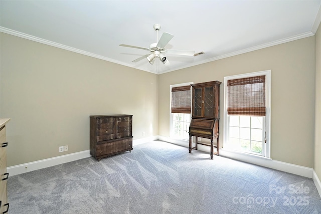 unfurnished room featuring ceiling fan, light colored carpet, and ornamental molding