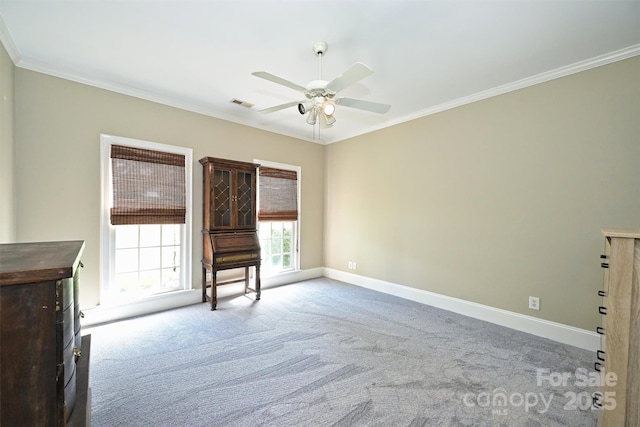 unfurnished living room with ceiling fan, carpet floors, and ornamental molding