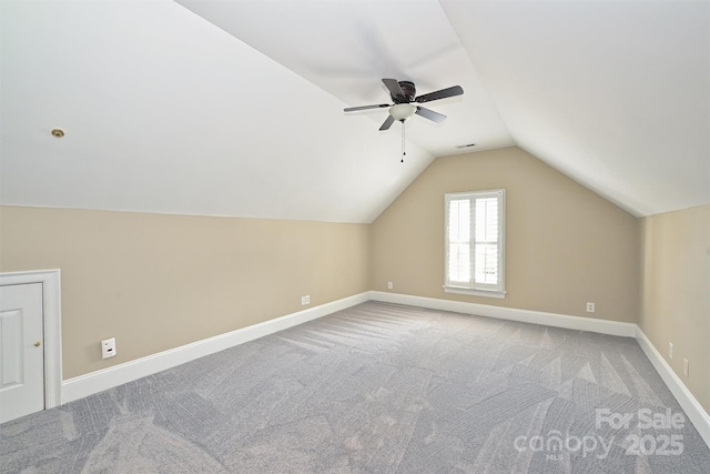 bonus room with ceiling fan, carpet, and lofted ceiling