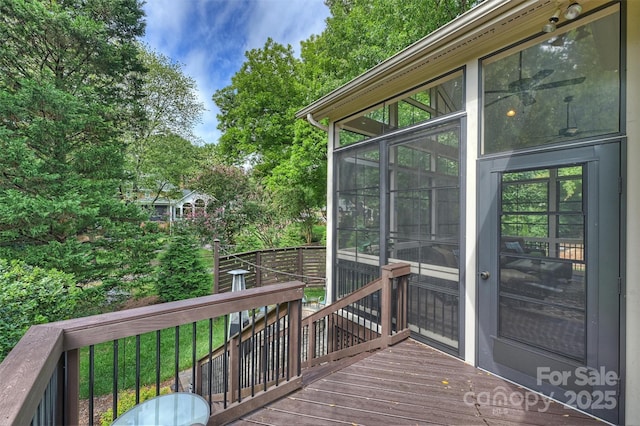 deck with a sunroom