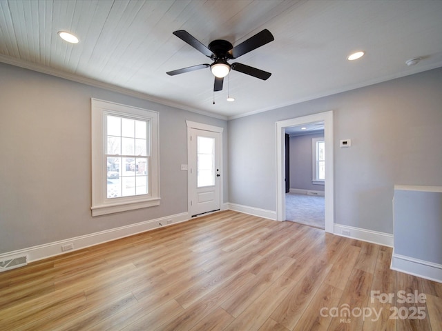 unfurnished room with ceiling fan, ornamental molding, and light hardwood / wood-style floors