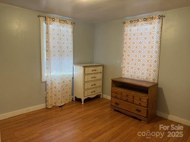 bedroom with light hardwood / wood-style flooring