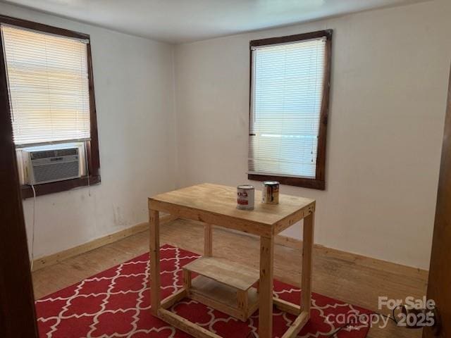 dining area with plenty of natural light and cooling unit