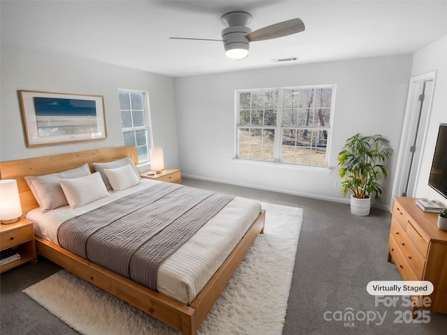 carpeted bedroom with ceiling fan