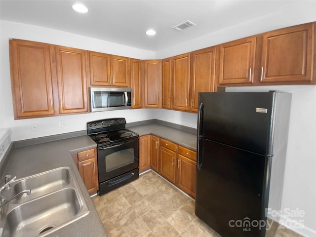 kitchen featuring sink and black appliances