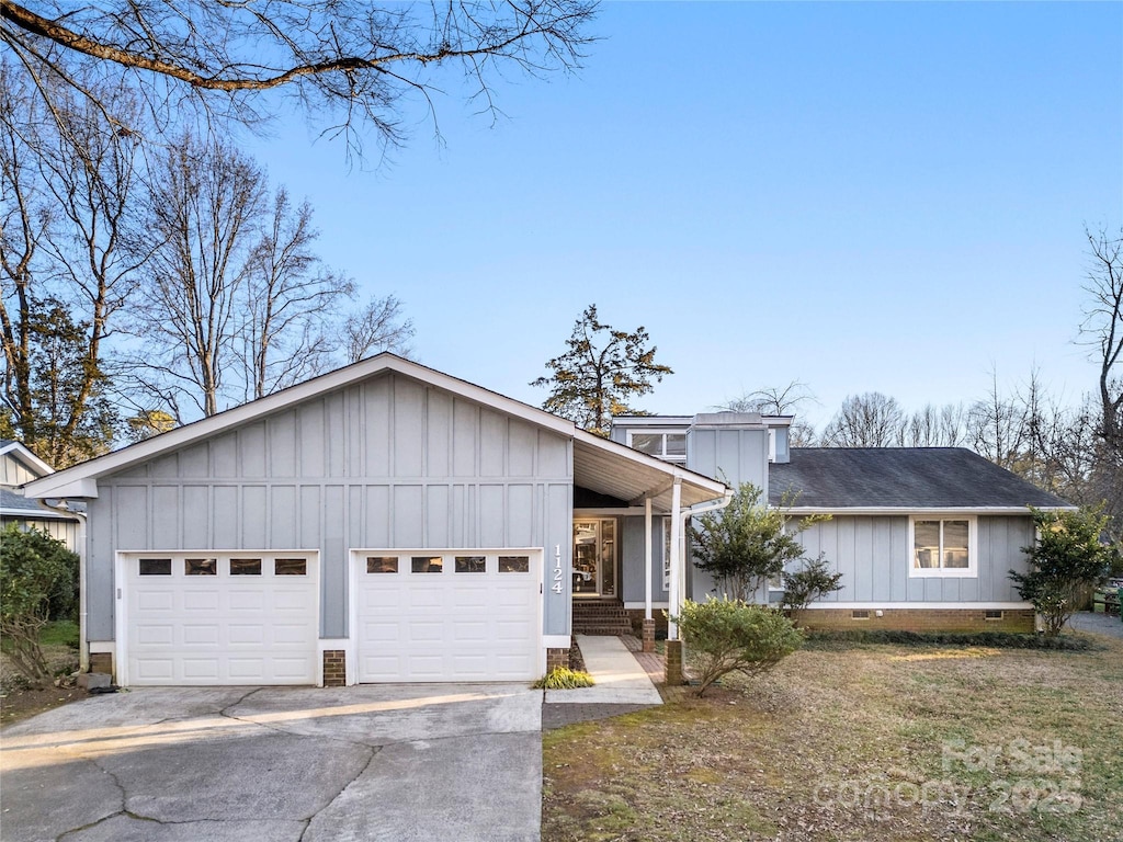 ranch-style house featuring a garage