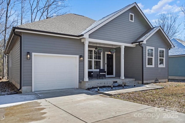 view of front of house with a garage and a porch