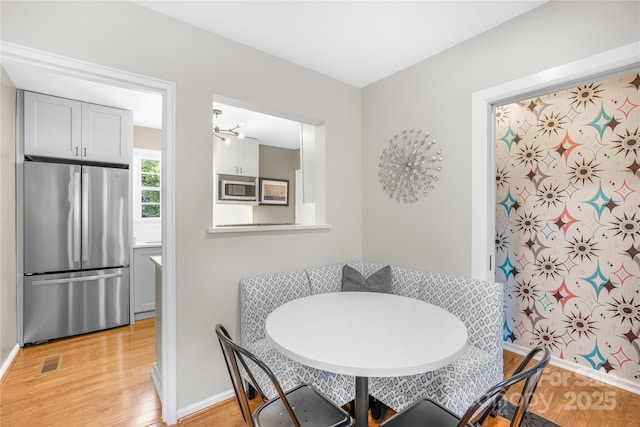 dining area featuring breakfast area and light hardwood / wood-style flooring