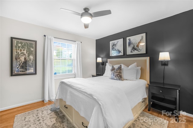 bedroom with ceiling fan and light hardwood / wood-style flooring