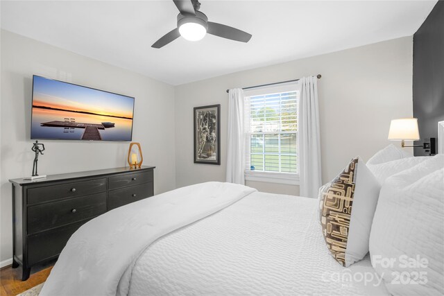 bedroom featuring hardwood / wood-style flooring and ceiling fan