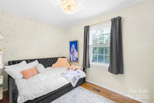 bedroom with wood-type flooring