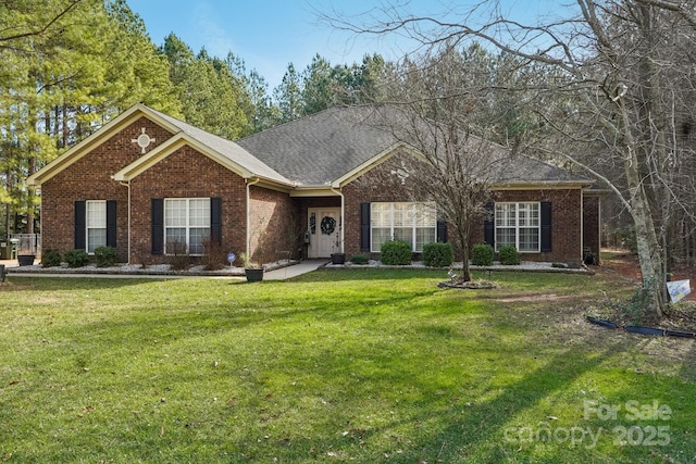 single story home with a front yard